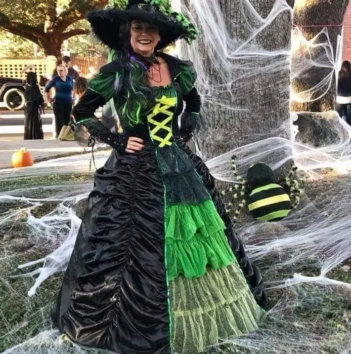 older woman in witch Halloween costume